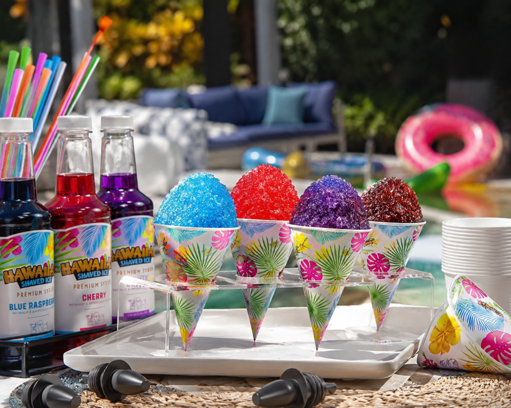 Colorful Hawaiian shaved ice syrup bottles and tropical snow cone cups at a summer pool party setup