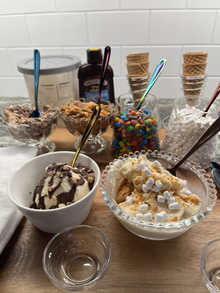 Classic Vanilla Bean Ninja CREAMi ice cream served with chocolate, candy, marshmallow, and cookie toppings