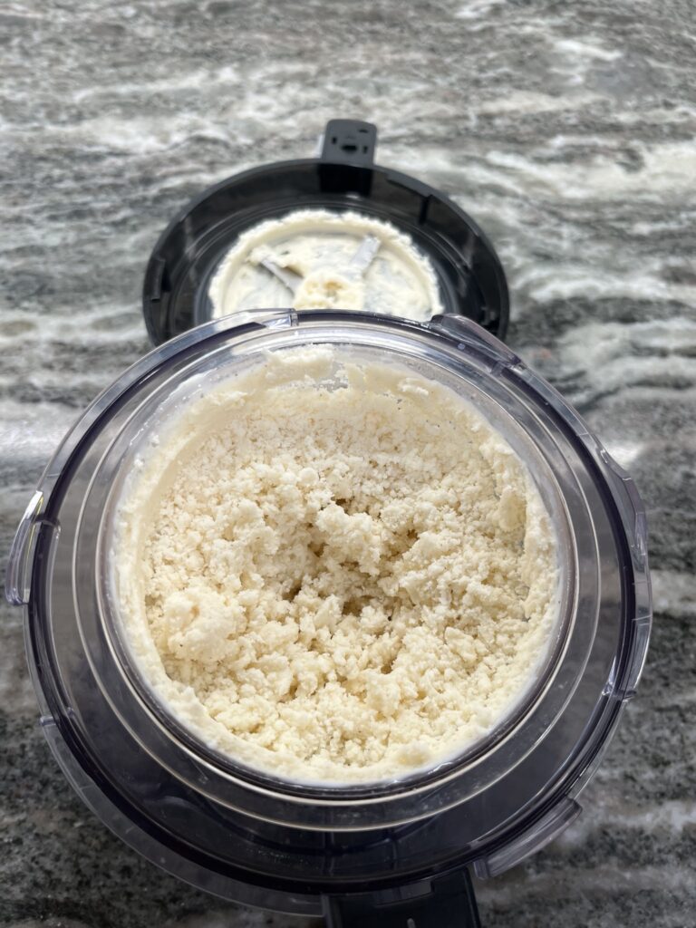 Classic Vanilla Bean Ninja CREAMi ice cream with a crumbly texture after the first spin