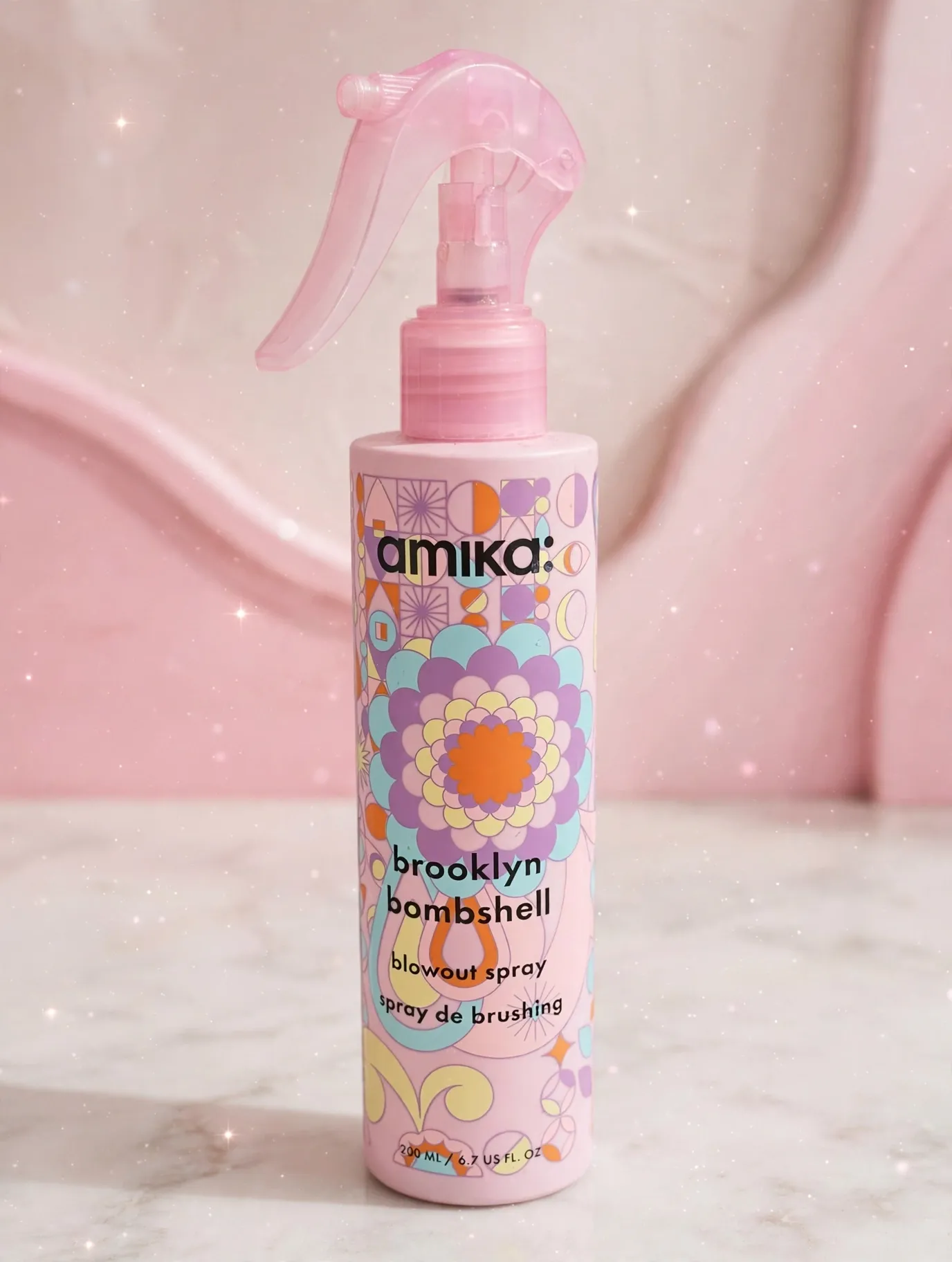 amika Brooklyn Bombshell Blowout Spray pink bottle