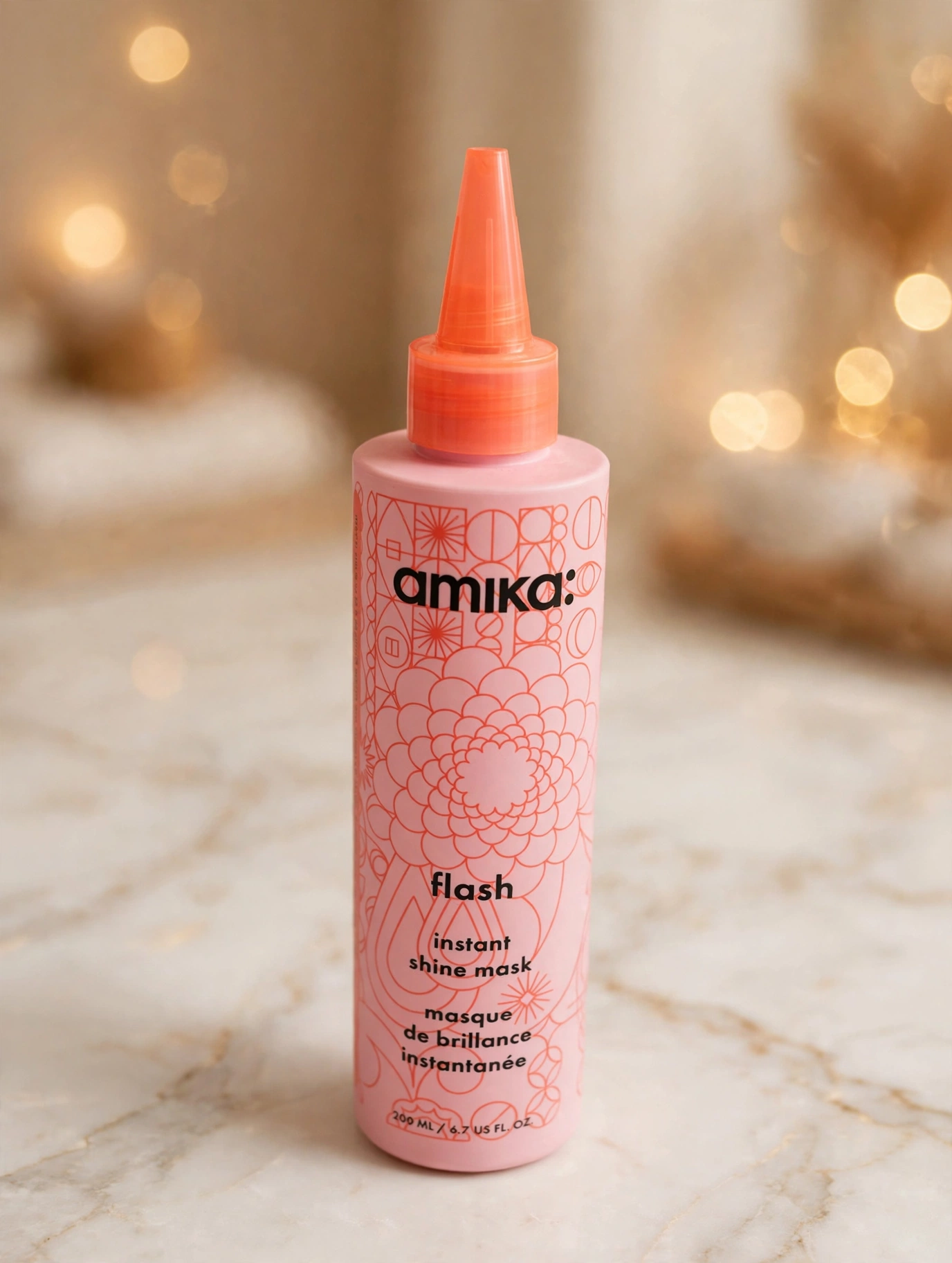 amika Flash Instant Shine Mask bottle on a bathroom counter