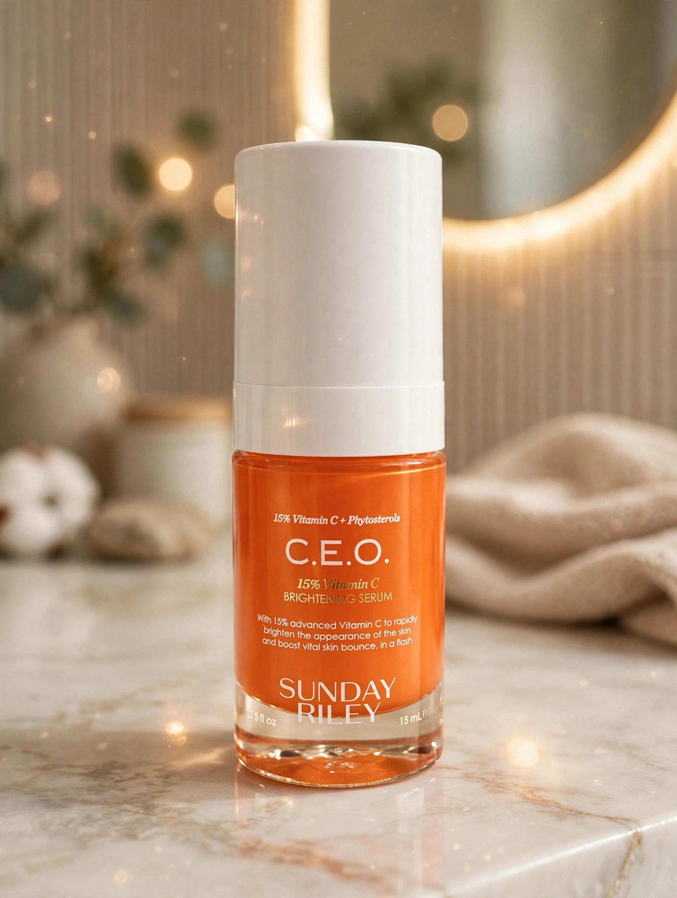 Sunday Riley C.E.O. Vitamin C Serum bottle on a marble bathroom counter
