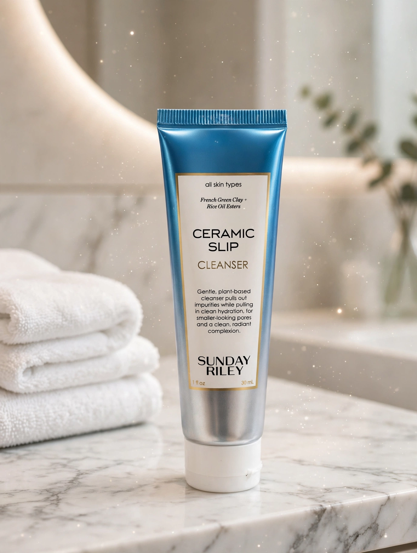 Sunday Riley Ceramic Slip Cleanser tube on a marble bathroom counter